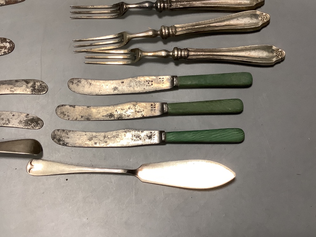 Four George IV silver handled table knives and four similar desert knives and a quantity of silver handled fruit knives and forks and two silver butter knives.